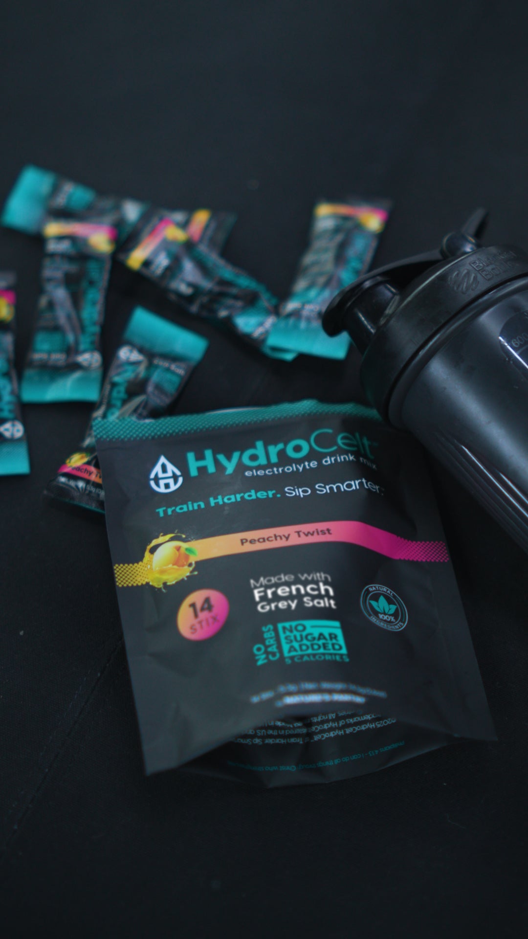 HydroCelt electrolyte drink mix packets with a black background