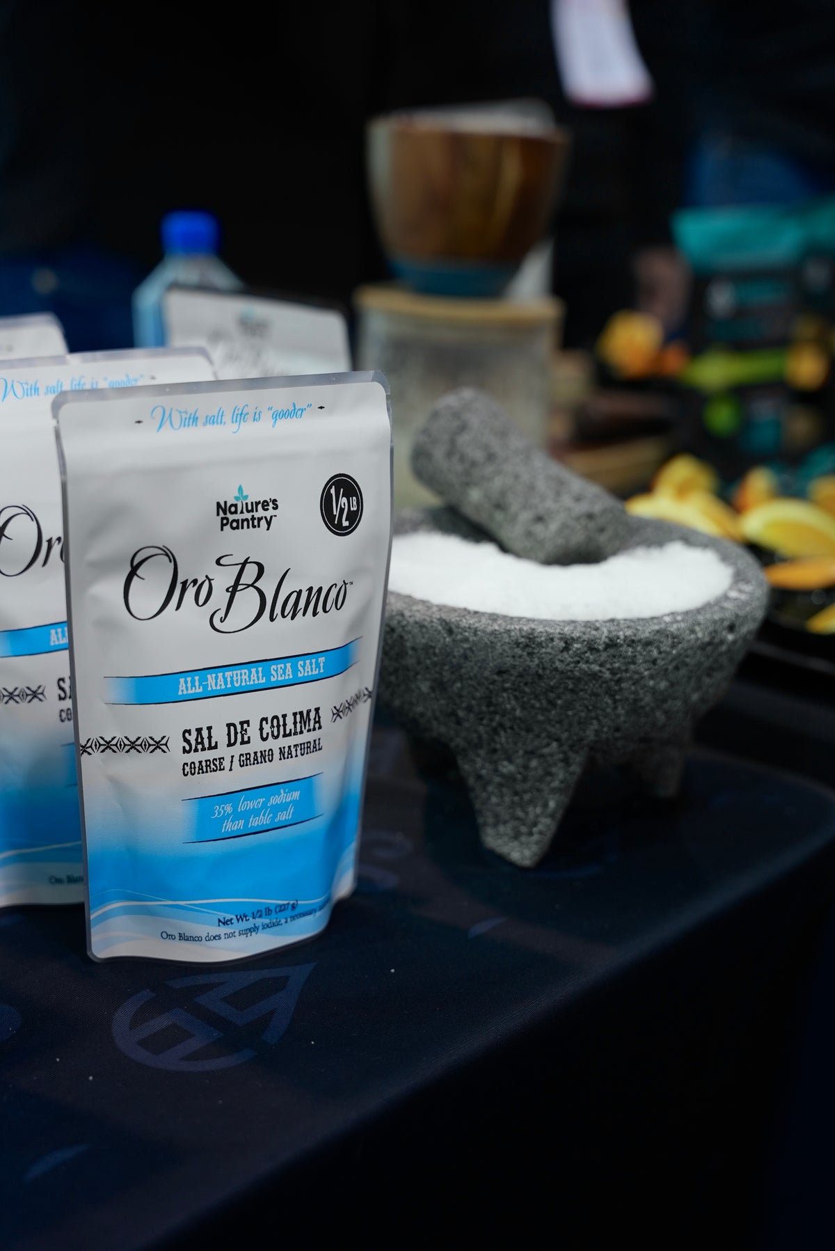 bag of Oro Blanco sea salt on a table next to a bowl with sea salt